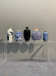 Five Chinese blue and white, iron-red and mirror-black-glazed snuff bottles, Qianlong mark, 19th C.
