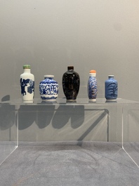 Five Chinese blue and white, iron-red and mirror-black-glazed snuff bottles, Qianlong mark, 19th C.