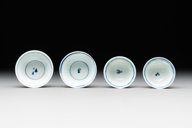 Seven Chinese blue, white and famille rose cups, six saucers and two English-decorated jarlets, Kangxi/Yongzheng