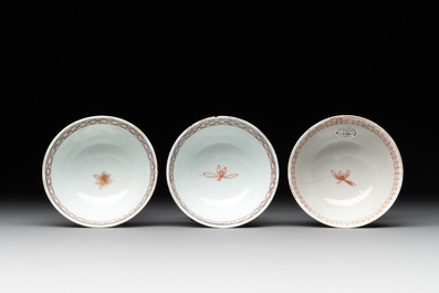Three Chinese famille rose 'flowers and butterflies' cups and saucers, Yongzheng