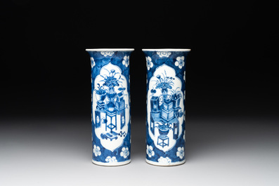 A pair of Chinese blue and white 'gu' vases, three jars, a plate and a plaque, Kangxi mark, 19th C.