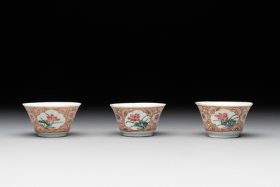 Seven Chinese blue, white and famille rose cups, six saucers and two English-decorated jarlets, Kangxi/Yongzheng