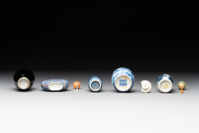Five Chinese blue and white, iron-red and mirror-black-glazed snuff bottles, Qianlong mark, 19th C.