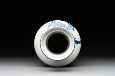 A Chinese blue and white vase with birds among flowering branches, 19th C.