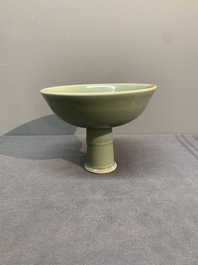 A Chinese Longquan celadon stem cup and two saucers, Ming