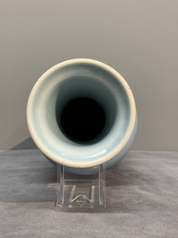Three Chinese turquoise-glazed covered vases and a lavender-blue-glazed vase, Kangxi mark, 19/20th C.