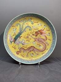 A Chinese famille rose yellow-ground 'dragon and phoenix' dish for the Straits or Peranakan market, Qianlong mark, 19th C.
