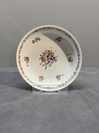 A Chinese famille rose 'Lowestoft' teapot, a plate, three cups and nine saucers, Qianlong