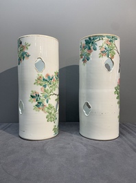 A pair of Chinese famille rose hat stands with birds among flowering branches, signed Zhu Shaoquan 朱少泉, dated 1892