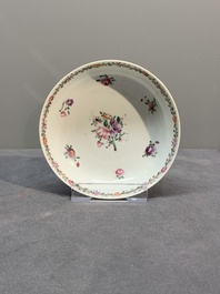 A Chinese famille rose 'Lowestoft' teapot, a plate, three cups and nine saucers, Qianlong