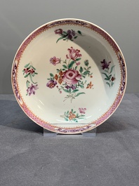 A Chinese famille rose 'Lowestoft' teapot, a plate, three cups and nine saucers, Qianlong