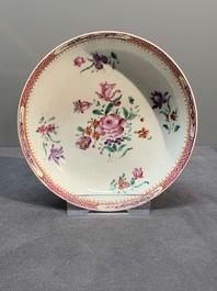 A Chinese famille rose 'Lowestoft' teapot, a plate, three cups and nine saucers, Qianlong