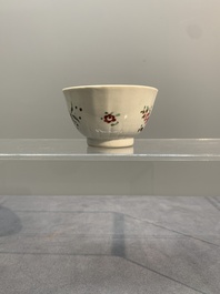 A Chinese famille rose 'Lowestoft' teapot, a plate, three cups and nine saucers, Qianlong