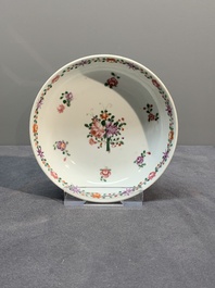 A Chinese famille rose 'Lowestoft' teapot, a plate, three cups and nine saucers, Qianlong