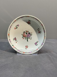 A Chinese famille rose 'Lowestoft' teapot, a plate, three cups and nine saucers, Qianlong
