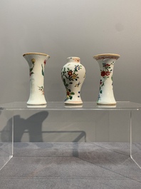 A Chinese famille rose tea caddy, two covered milk jugs and three vases, Yongzheng/Qianlong