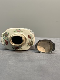 A Chinese famille rose tea caddy, two covered milk jugs and three vases, Yongzheng/Qianlong