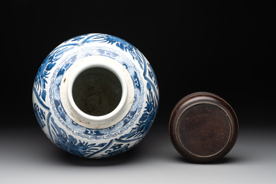 A Chinese blue and white jar and wooden cover, Kangxi