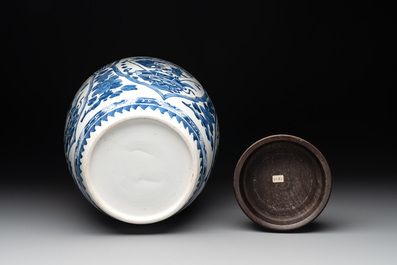 A Chinese blue and white jar and wooden cover, Kangxi