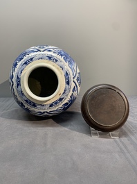 A Chinese blue and white jar and wooden cover, Kangxi