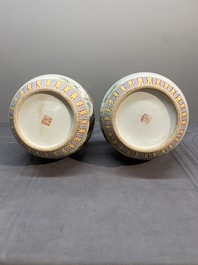A pair of Chinese famille rose bottle vases with flowers, Qianlong mark, Republic