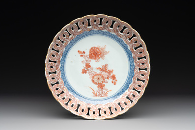 A rare Chinese famille rose cup and a gilt-decorated iron-red, blue and white plate with reticulated border, Kangxi/Qianlong
