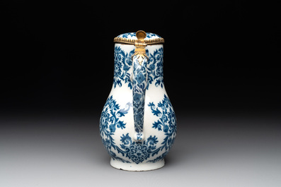 A fine blue and white Dutch Delft gilt-silver-mounted ewer and cover in the style of Daniel Marot, ca. 1700