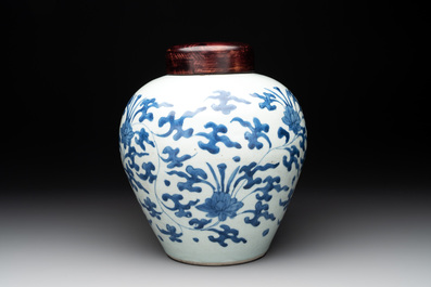 A Chinese blue and white 'lotus scroll' vase with wooden cover, Kangxi