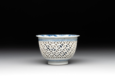 A Chinese blue and white reticulated double-walled cup and saucer, fu mark, Kangxi