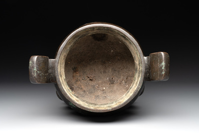A Chinese bronze tripod censer with two handles, Ming