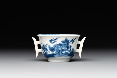 A rare Chinese blue and white 'qilin and phoenix' cup with handles, Kangxi