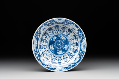 A Chinese blue and white reticulated double-walled cup and saucer, fu mark, Kangxi