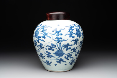 A Chinese blue and white 'lotus scroll' vase with wooden cover, Kangxi