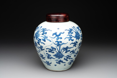 A Chinese blue and white 'lotus scroll' vase with wooden cover, Kangxi