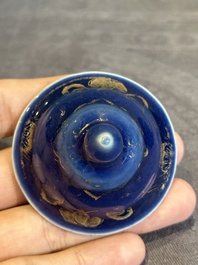 A Chinese gilt-decorated powder-blue bowl and a covered jarlet, Kangxi/Qianlong