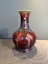 A Chinese flamb&eacute;-glazed vase with archaistic dragon handles, 19th C.