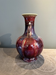 A Chinese flamb&eacute;-glazed vase with archaistic dragon handles, 19th C.