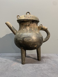 A Chinese inscribed archaic bronze tripod ritual wine vessel and cover, 'He 盉', Western Zhou