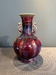 A Chinese flamb&eacute;-glazed vase with archaistic dragon handles, 19th C.