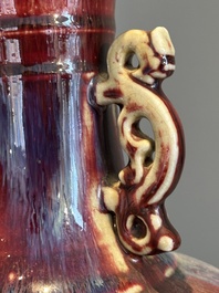 A Chinese flamb&eacute;-glazed vase with archaistic dragon handles, 19th C.