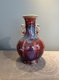 A Chinese flamb&eacute;-glazed vase with archaistic dragon handles, 19th C.