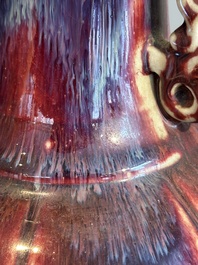 A Chinese flamb&eacute;-glazed vase with archaistic dragon handles, 19th C.