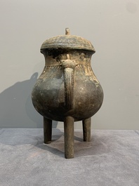 A Chinese inscribed archaic bronze tripod ritual wine vessel and cover, 'He 盉', Western Zhou