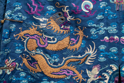 A Chinese gold thread embroidered blue-ground silk 'dragon' robe, 19th C.