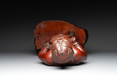A Japanese lacquered wooden figure of a guardian, 19th C.