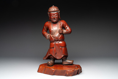 A Japanese lacquered wooden figure of a guardian, 19th C.