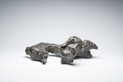 A large Chinese Lingbi stone scholar's rock on wooden stand, 19/20th C.