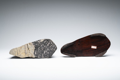 A Chinese wucai Lingbi stone scholar's rock on wooden stand, 20th C.