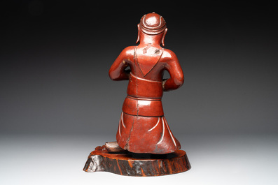 A Japanese lacquered wooden figure of a guardian, 19th C.