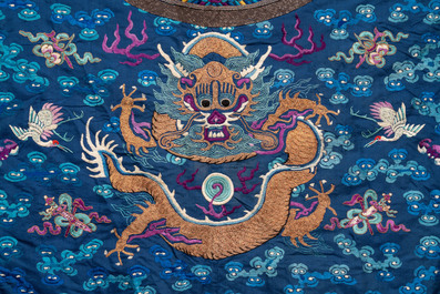 A Chinese gold thread embroidered blue-ground silk 'dragon' robe, 19th C.